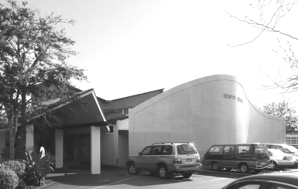 Public building with curved masonry wall and entry canopy